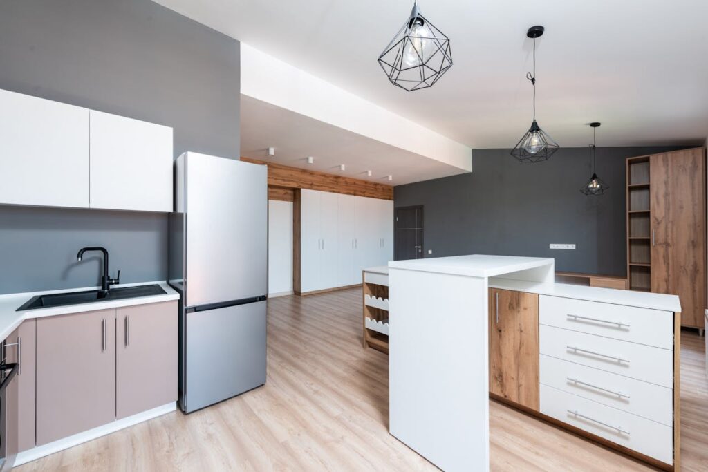 pexels photo 8146326 Spacious modern kitchen with minimalist design and elegant fixtures.